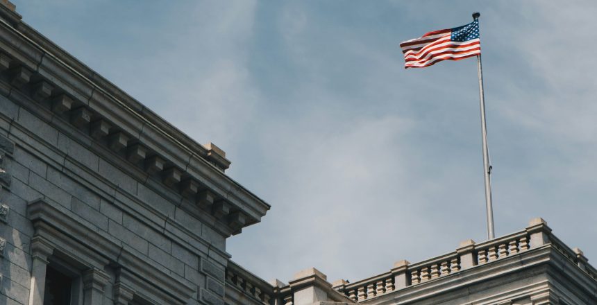 American flag flying over a state building