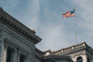 American flag flying over a state building